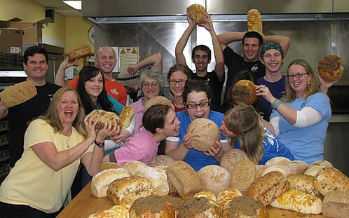 Great Harvest Clackamas crew with whole wheat bread photo