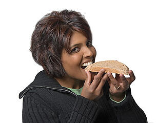 eating slice of bread