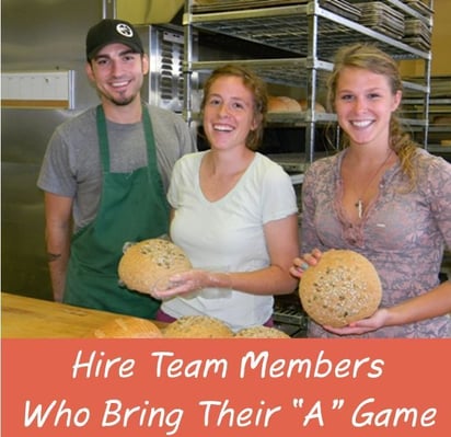 bakery employees smiling in bakery