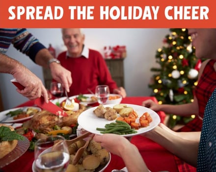 Photo of holiday meal with text overlay that says "Spread the holiday cheer"